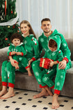 Verde conjunto de pijama familiar a juego de copos de nieve navideños en mono