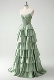 Vestido largo de baile con corsé de cuentas y cuentas de princesa en color burdeos con abertura