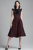 Vestido negro de lunares rojos con volantes