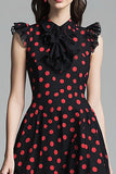Vestido negro de lunares rojos con volantes