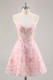 Vestido de fiesta corto floral rosa con corsé sin tirantes y apliques